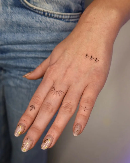 Tiny Minimalist Dots Birds Branches on Women Fingers Tattoo by @tattoo.esthete