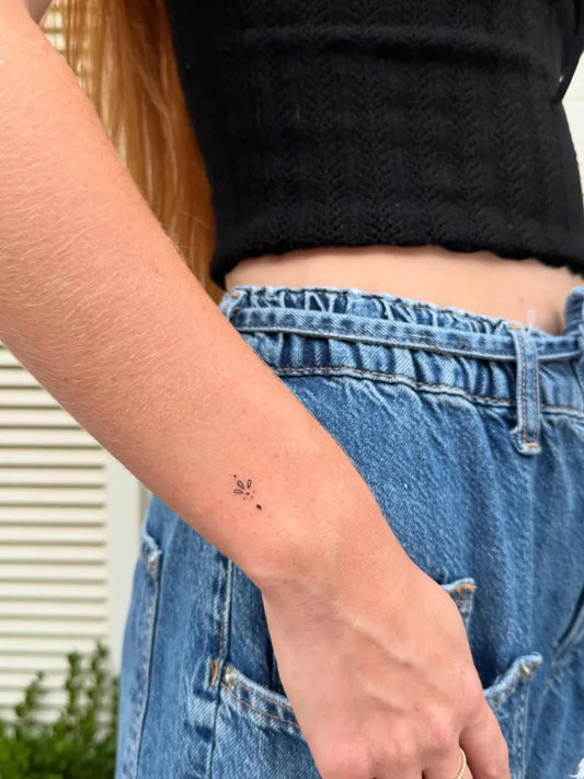 Tiny Minimalist Dots Cross on Women Wrist Tattoo by @highvibestattoo