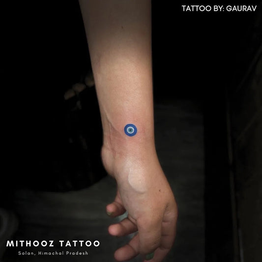 Tiny Minimalist Evil Eye on Women Wrist Tattoo by @kaosinkarnate