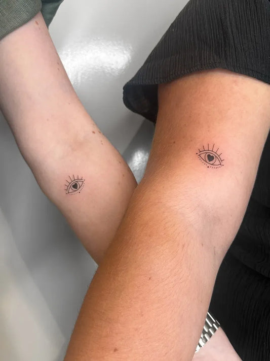 Tiny Minimalist Eye on Friends Arms Matching Tattoo by @utcatattoos