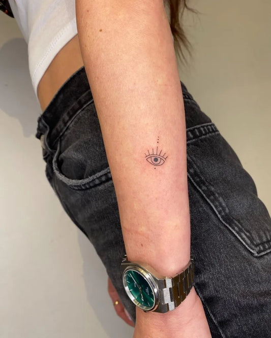 Tiny Minimalist Eye on Women Arm Tattoo by @ns_tattoo_boutique