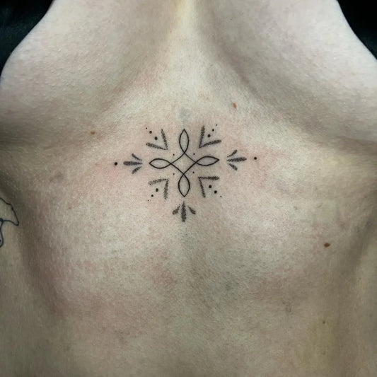 Tiny Minimalist Floral Interlace on Women Sternum Tattoo by @_tattoodez_