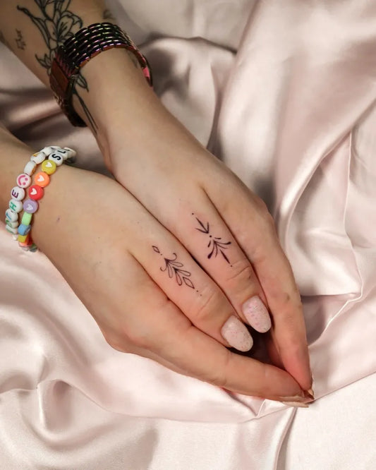 Tiny Minimalist Foliage on Women Fingers Tattoo by @krextiv