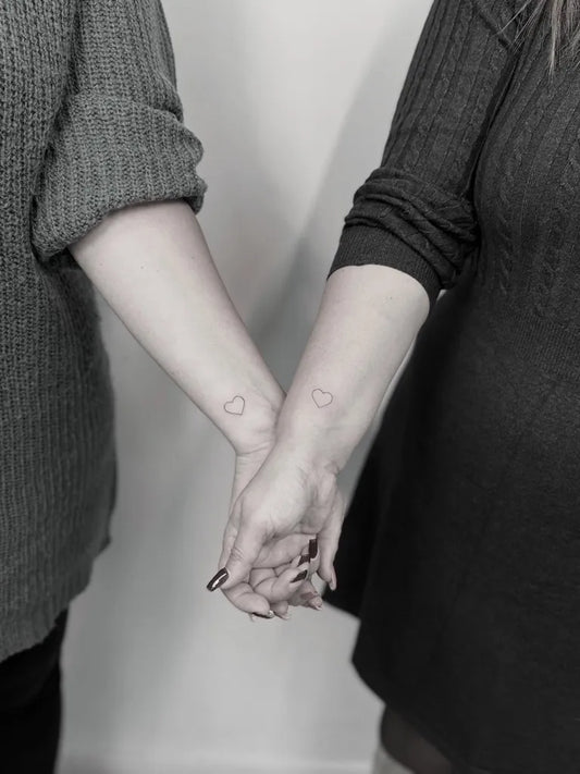 Tiny Minimalist Heart on Couple Wrist Matching Tattoo by @ludo_inkspire