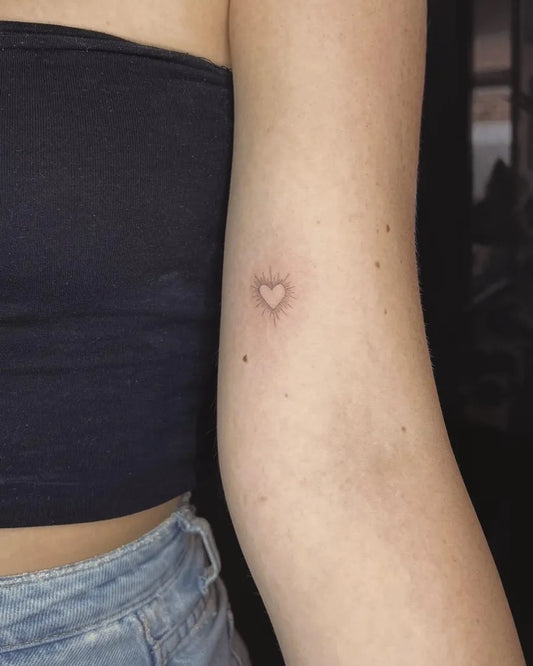 Tiny Minimalist Heart on Women Arm Tattoo by @tiny.tattoo.lines