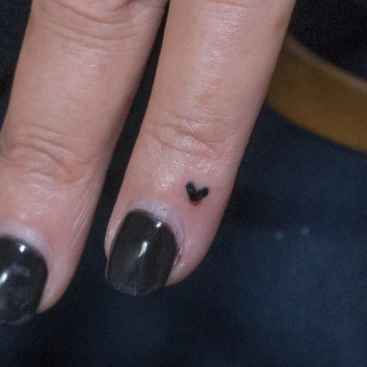 Tiny Minimalist Heart on Women Finger Tattoo by @donaldvoelker