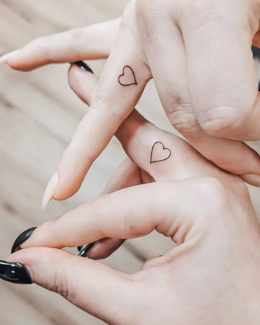 Tiny Minimalist Heart on Women Fingers Tattoo by @lottamariasi