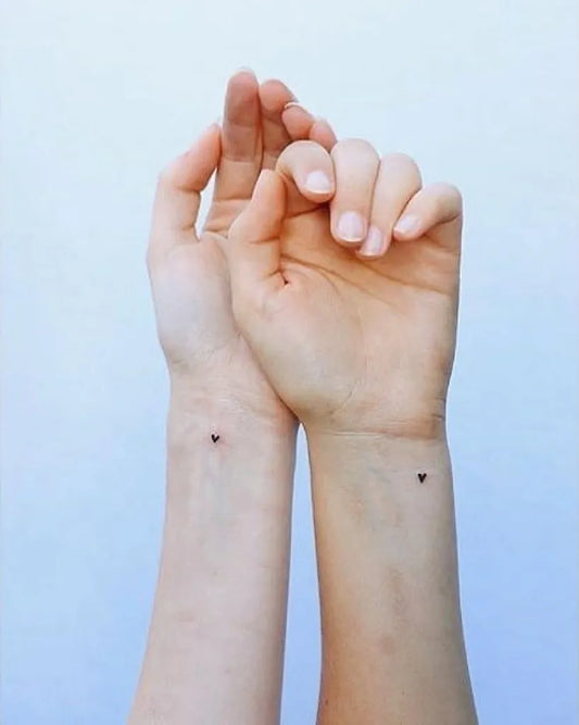 Tiny Minimalist Hearts on Women Wrist Tattoo by @little.tattoos