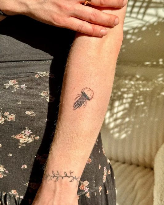 Tiny Minimalist Jellyfish on Women Arm Tattoo by @misterch_
