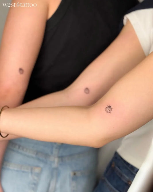 Tiny Minimalist Friends Matching Ladybug Tattoo on Women Arm by @west4tattoo