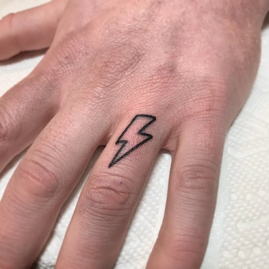 Tiny Minimalist Lightning Bolt Tattoo on Men Hand by @sbh_tattoo