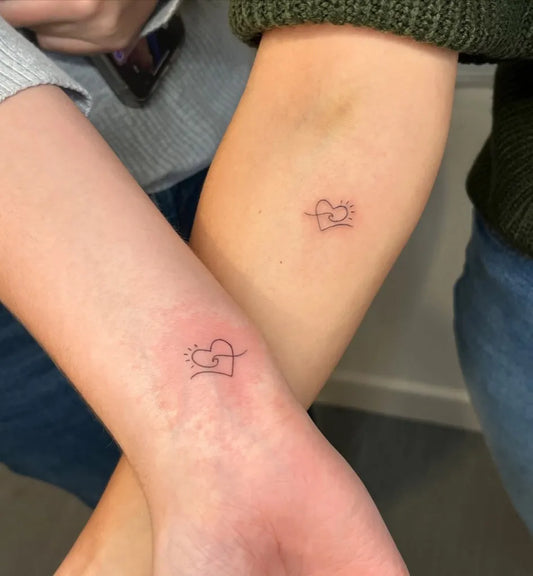 Tiny Minimalist Linked Heart on Couple Arm Matching Tattoo by @aurastudioskent
