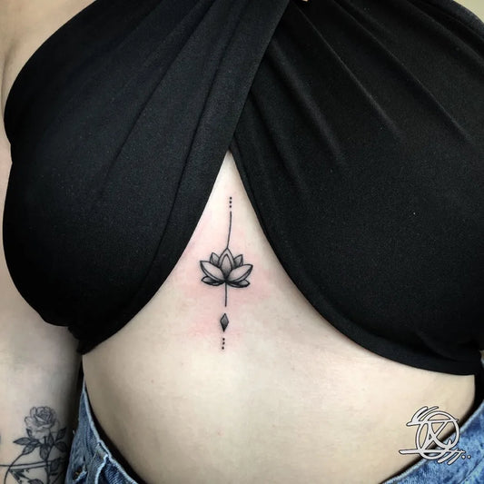 Tiny Minimalist Lotus with Dots on Women Sternum Tattoo by @xist_tattoo