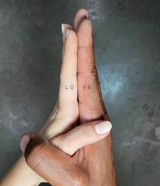 Tiny Minimalist Love Word on Couple Fingers Matching Tattoo by @hautewaldorf