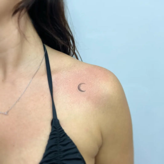 Tiny Minimalist Moon Tattoo on Women Shoulder by @tattoolegendtenerife