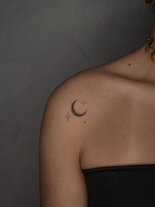 Tiny Minimalist Moon and Star Tattoo on Women Shoulder by @richi.tats