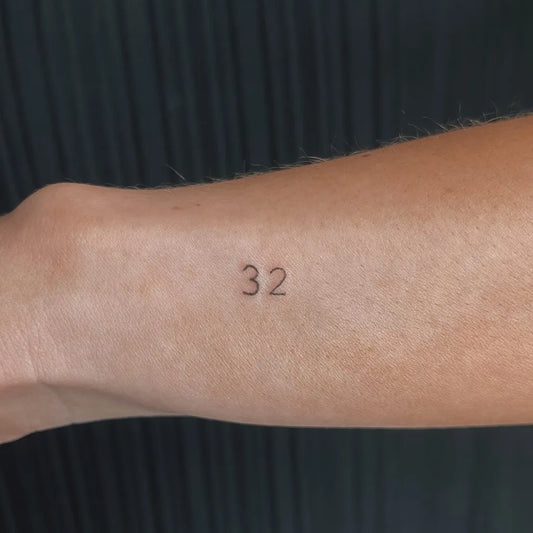 Tiny Minimalist Numbers 32 Tattoo on Women Wrist by @nclttpokes