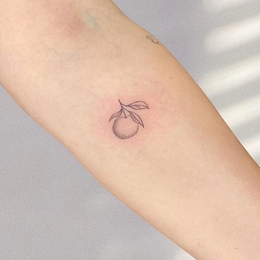 Tiny Minimalist Orange Leaf on Women Arm Tattoo by @puddingclubpokes