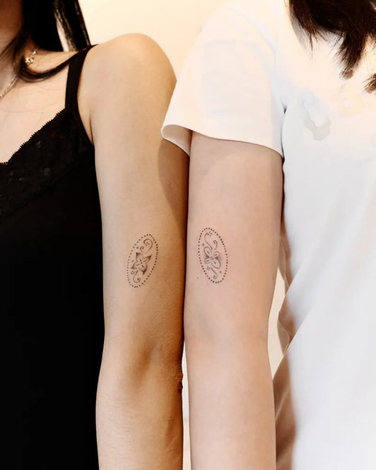 Tiny Minimalist Oval with Face on Friends Arms Matching Tattoo by @itsumo.tats