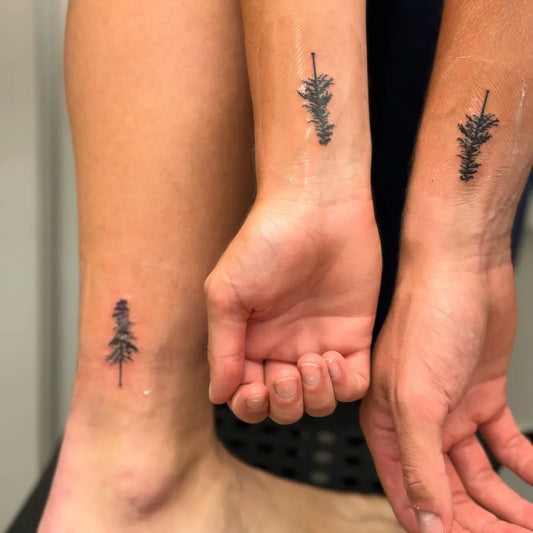 Tiny Minimalist Pine Tree on Couple Wrist Ankle Matching Tattoo by @fiinchtattoos