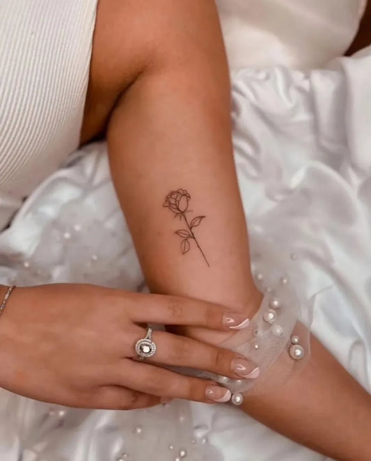 Tiny Minimalist Rose on Women Arm Tattoo by @tinytattoos_feathertouch