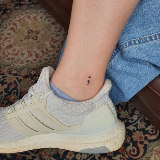 Tiny Minimalist Semicolon on Women Ankle Tattoo by @eric_manio