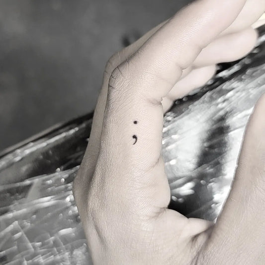Tiny Minimalist Semicolon on Women Finger Tattoo by @tattooist_ria