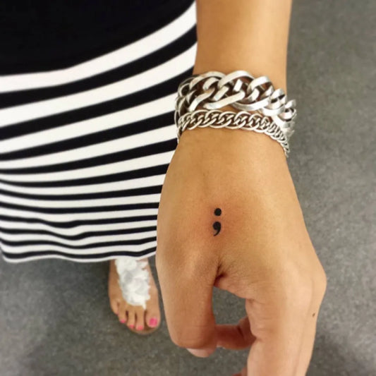 Tiny Minimalist Semicolon on Women Hand Tattoo by @nito_ink