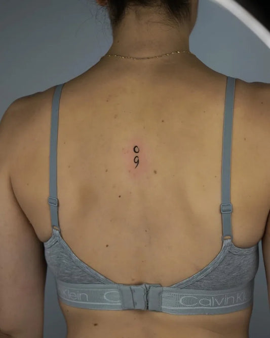 Tiny Minimalist Semicolon on Women Upper Back Tattoo by @solar.ink.the.sky