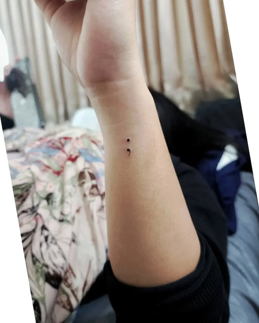 Tiny Minimalist Semicolon on Women Wrist Tattoo by @coreographics