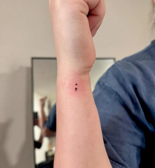 Tiny Minimalist Semicolon on Women Wrist Tattoo by @graceadelinaink