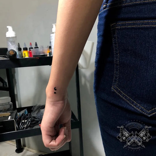 Tiny Minimalist Semicolon on Women Wrist Tattoo by @ink.us_tattoo
