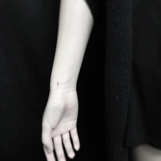 Tiny Minimalist Semicolon on Women Wrist Tattoo by @jingstattoo