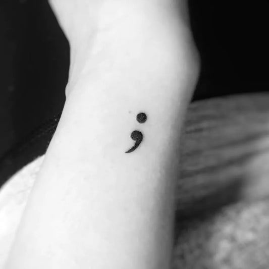 Tiny Minimalist Semicolon on Women Wrist Tattoo by @melaniejill.tattoo