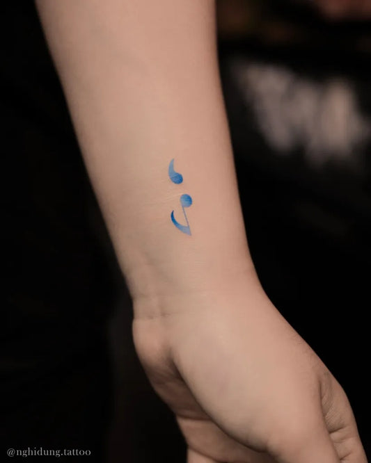Tiny Minimalist Semicolon on Women Wrist Tattoo by @nghidung.tattoo
