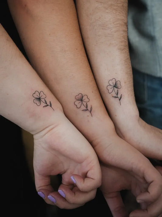 Tiny Minimalist Shamrock on Friends Wrists Matching Tattoo by @clintmaxwelltattoo
