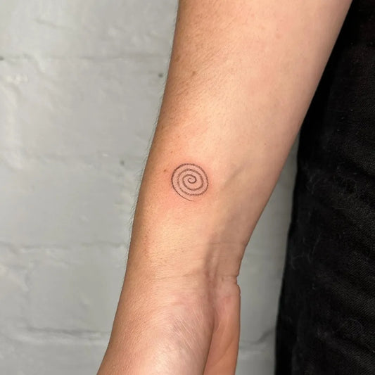 Tiny Minimalist Spiral on Women Wrist Tattoo by @inkdbylyss