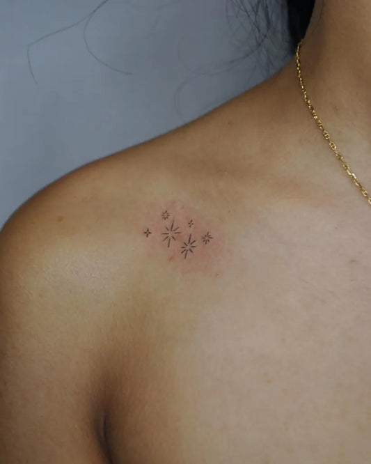Tiny Minimalist Star Cluster Tattoo on Women Collarbone by @sincerelybriget