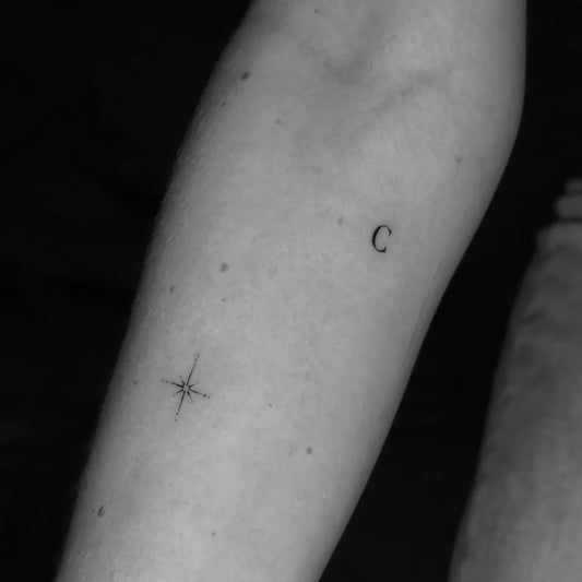 Tiny Minimalist Star and Letter Tattoo on Women Arm by @nanotattoos5