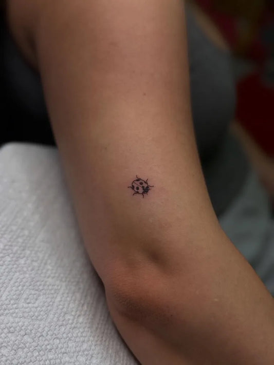 Tiny Minimalist Star on Women Arm Tattoo by @lumistudiollc