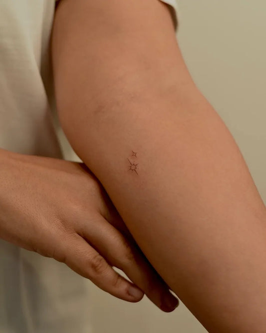 Tiny Minimalist Star on Women Arm Tattoo by @nikatattooing
