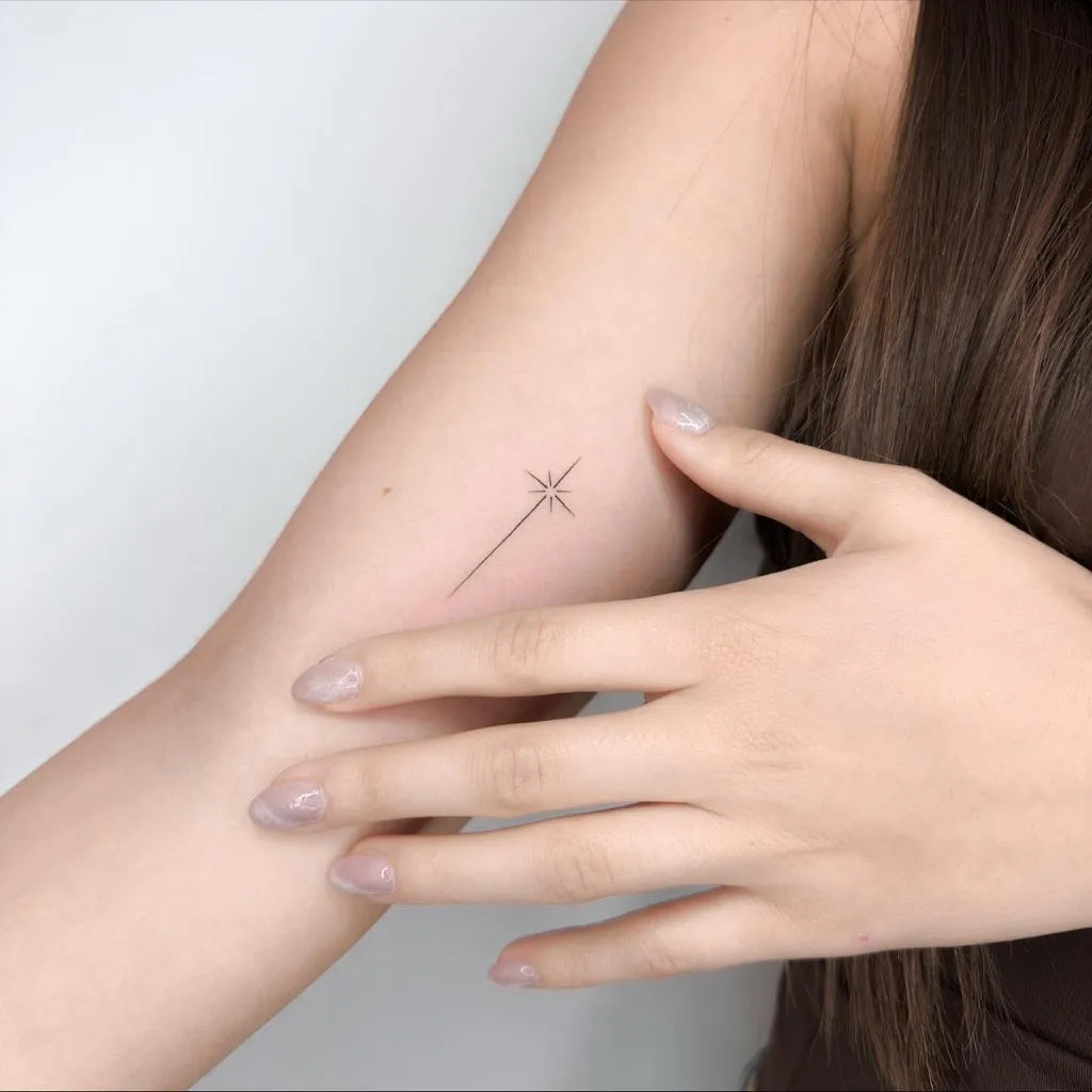 Tiny Minimalist Star on Women Arm Tattoo by @ongarato_tattoo