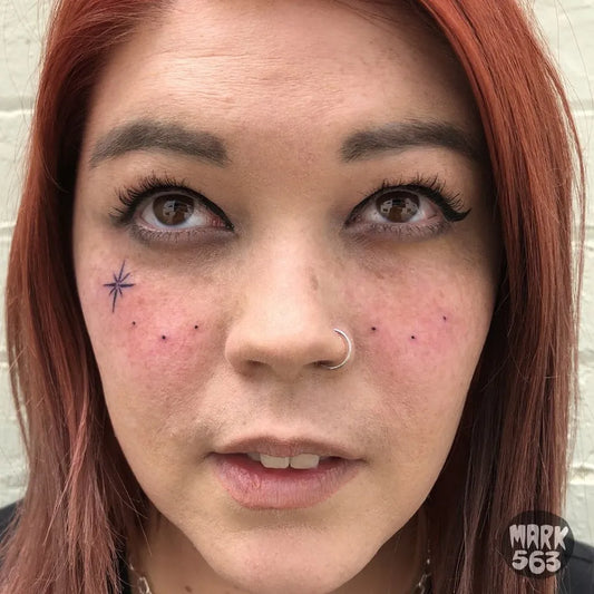 Tiny Minimalist Star on Women Face Tattoo by @mark563