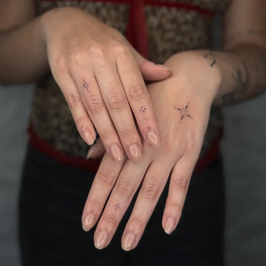 Tiny Minimalist Star on Women Fingers Tattoo by @xenia_tats