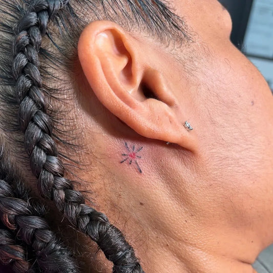 Tiny Minimalist Starburst on Women Neck Tattoo by @honeyz.ink
