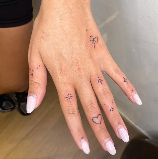 Tiny Minimalist Stars Dots Heart on Women Fingers Tattoo by @ns_tattoo_boutique