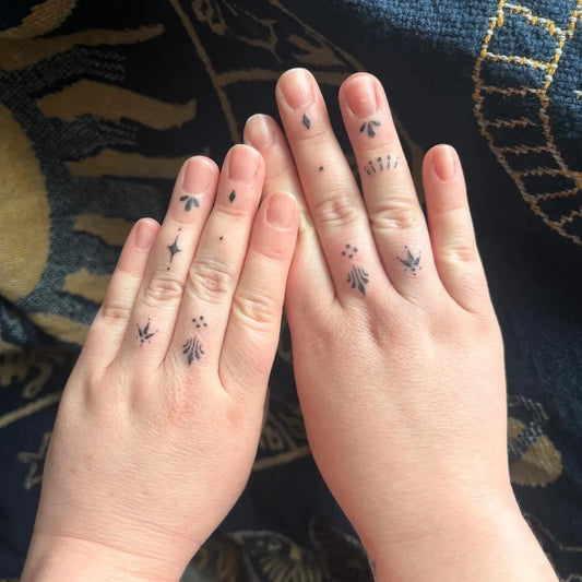 Tiny Minimalist Stars Leaves on Women Fingers Tattoo by @betty.boo.tattoo