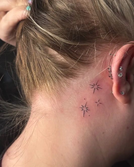 Tiny Minimalist Stars Tattoo on Women Behind the Ear by @burnedheartstattoos
