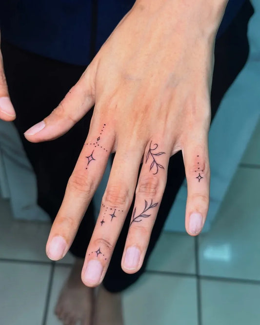 Tiny Minimalist Stars Vines on Women Fingers Tattoo by @ancienttattoostudio