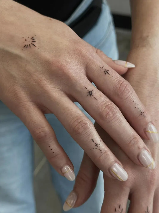 Tiny Minimalist Stars on Women Fingers Tattoo by @andyoutattoo